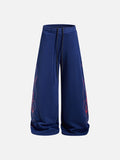 DAXUEN camouflage sweatpants with bold swirling graphics
