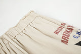 DAXUEN light beige wide-leg trousers with bold text graphic