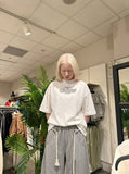 DAXUEN white oversized text graphic mock neck t-shirt — model photo