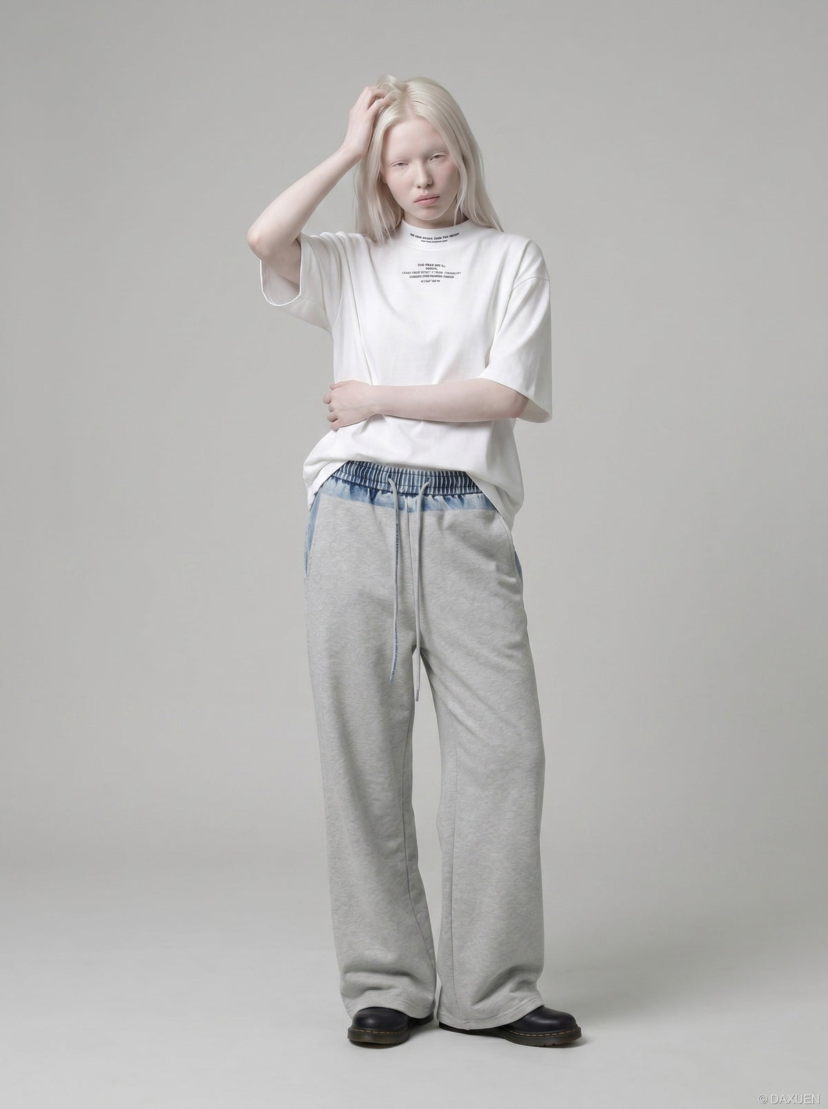 DAXUEN white oversized text graphic mock neck t-shirt — model photo
