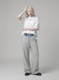 DAXUEN white oversized text graphic mock neck t-shirt — model photo