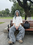 DAXUEN black oversized triangular graphic tee — model photo