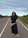 DAXUEN black oversized triangular graphic tee — model photo