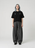 DAXUEN black oversized triangular graphic tee — model photo