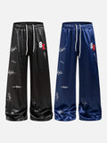 DAXUEN black satin wide-leg pants with bold two-letter graphic