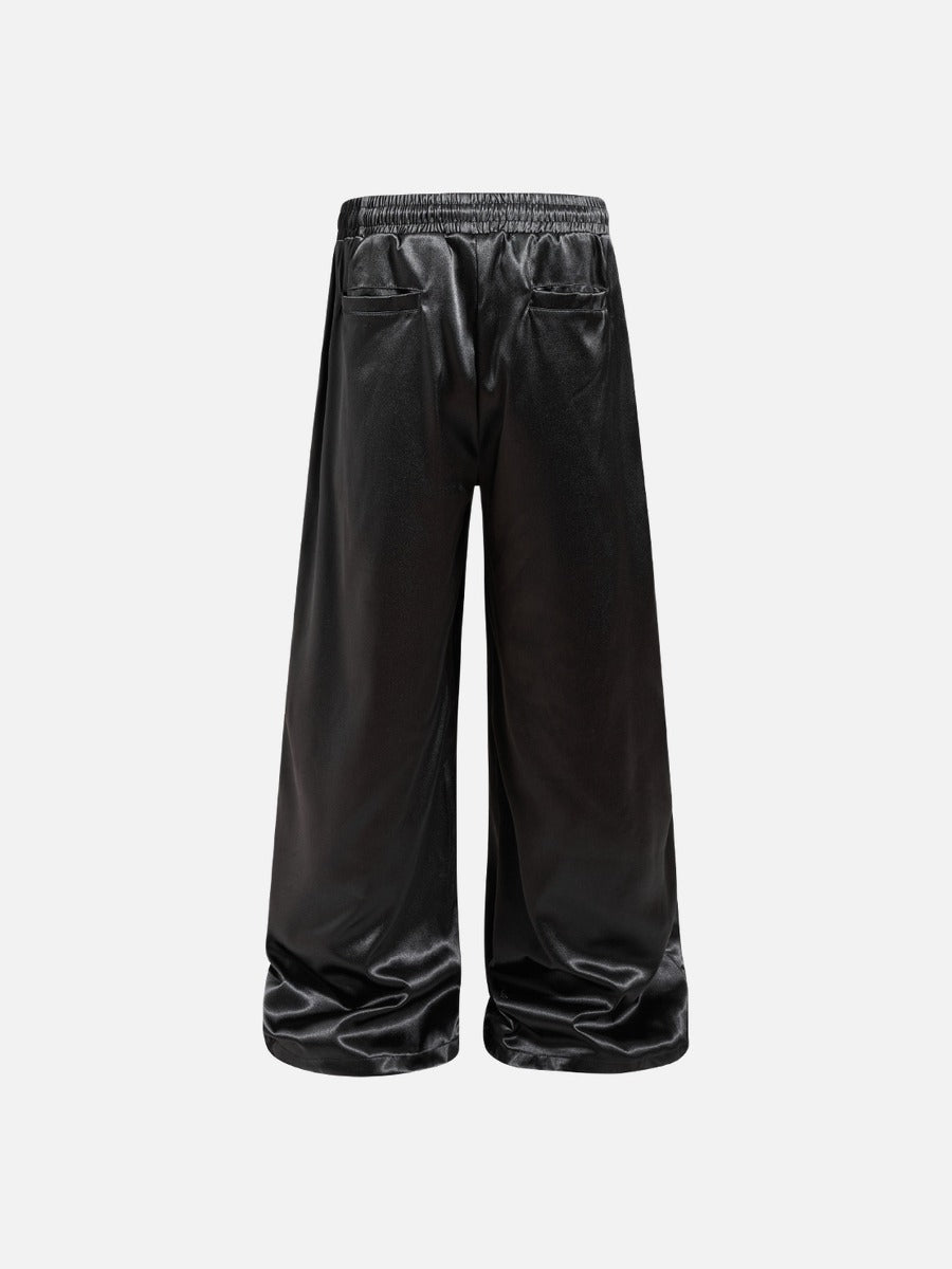DAXUEN black satin wide-leg pants with bold two-letter graphic