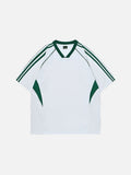 Oversized white streetwear football jersey with dark green V-neck collar, shoulder stripes, and side panels.