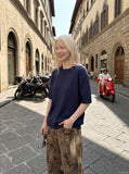 DAXUEN black vertical ribbed henley knit top — model photo