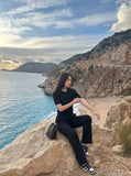 DAXUEN black vertical ribbed henley knit top — model photo