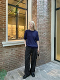 DAXUEN black vertical ribbed henley knit top — model photo