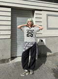 DAXUEN Short-sleeved loose-fitting V-neck top with stripes and graphics — model photo