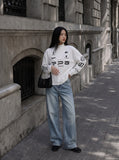 DAXUEN black bold graphic mock neck pullover top — model photo