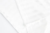 DAXUEN white long-sleeve polo shirt with bold wordmark and shield graphic