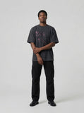 DAXUEN Vintage short-sleeve T-shirt with distressed graphic — model photo