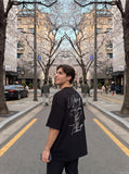 DAXUEN white oversized tulip outline graphic tee — model photo
