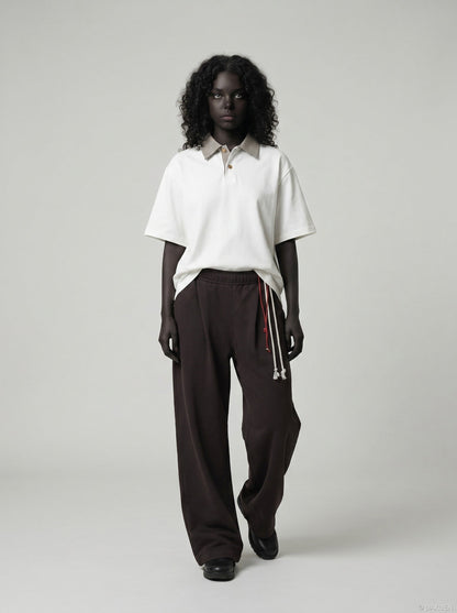 DAXUEN Boxy short-sleeve polo shirt with houndstooth collar — model photo