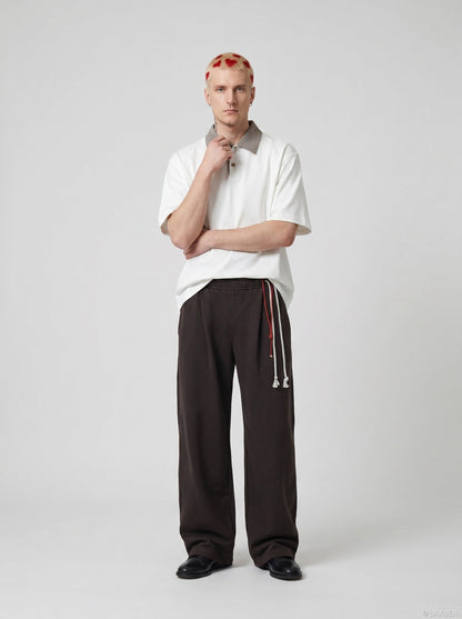 DAXUEN Boxy short-sleeve polo shirt with houndstooth collar — model photo