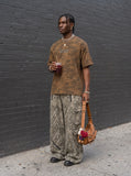 DAXUEN brown camouflage graphic oversized t-shirt — model photo