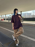 DAXUEN black oversized brushstroke print t-shirt — model photo