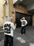 DAXUEN Oversized graphic T-shirt with playful print — model photo