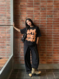 DAXUEN Oversized graphic T-shirt with playful print — model photo