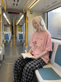 DAXUEN Oversized Sketch Dog Graphic Tee — model photo