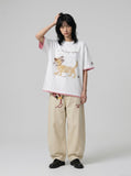 DAXUEN Oversized Sketch Dog Graphic Tee — model photo