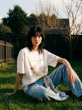 DAXUEN Oversized Sketch Dog Graphic Tee — model photo