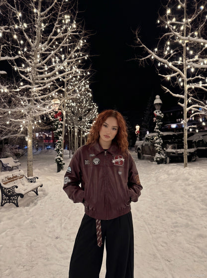 DAXUEN burgundy bomber jacket with beetle club patches — model photo