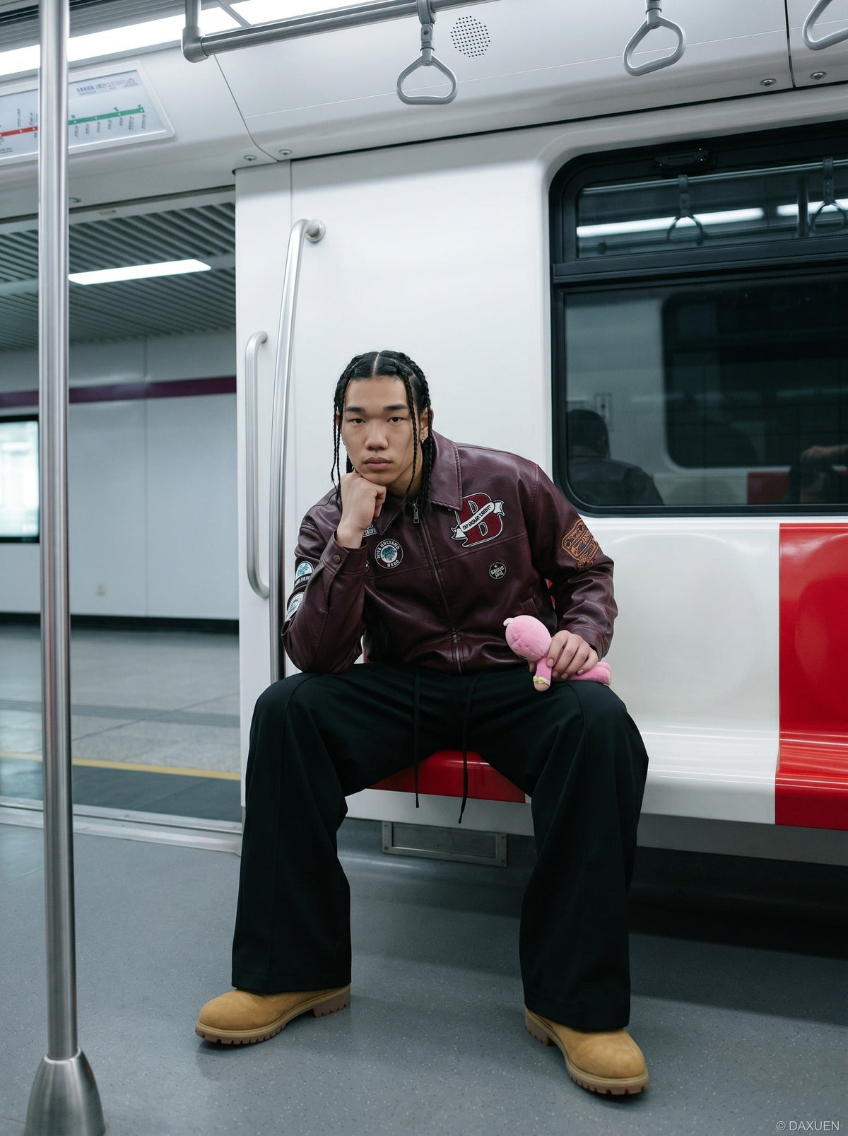 DAXUEN burgundy bomber jacket with beetle club patches — model photo