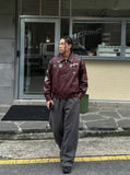 DAXUEN burgundy bomber jacket with beetle club patches — model photo