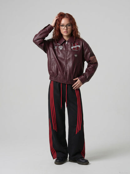 DAXUEN burgundy bomber jacket with beetle club patches — model photo