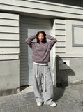 DAXUEN burgundy striped knit long-sleeve polo shirt — model photo