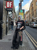 DAXUEN Oversized short-sleeved graphic T-shirt with urban print — model photo