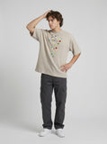 DAXUEN Oversized short-sleeve t-shirt with button graphic — model photo