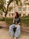 DAXUEN Camo graphic t-shirt with bold text and designs — model photo