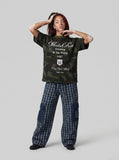 DAXUEN Camo graphic t-shirt with bold text and designs — model photo