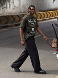 DAXUEN Camo graphic t-shirt with bold text and designs — model photo