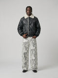 DAXUEN Wide-leg camouflage pants with pockets — model photo