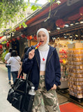 DAXUEN Wide-leg camouflage pants with textured fabric — model photo
