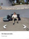 DAXUEN Wide-leg camouflage pants with textured fabric — model photo