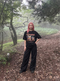 DAXUEN black cartoon beach relaxation graphic t-shirt — model photo