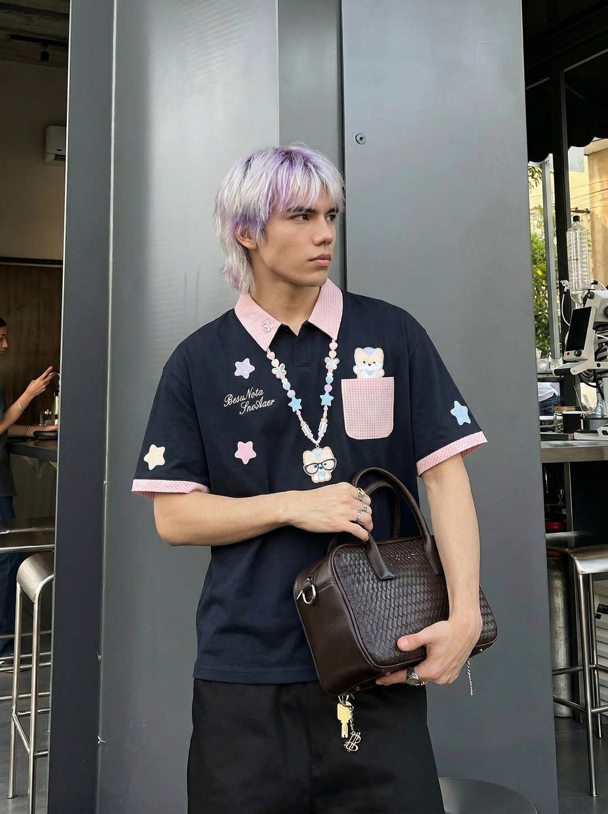 DAXUEN Short-sleeved polo shirt with cartoon bear design — model photo
