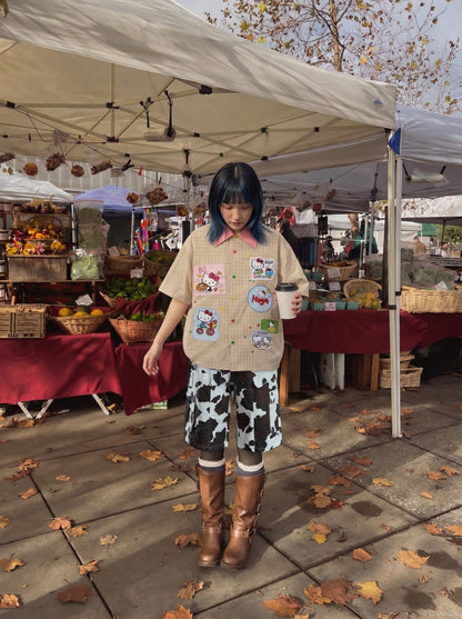 DAXUEN Short-sleeved plaid button-up shirt with cartoon cat patches — model photo