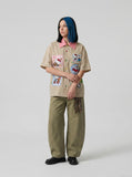 DAXUEN Short-sleeved plaid button-up shirt with cartoon cat patches — model photo