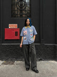 DAXUEN Short-sleeved plaid button-up shirt with cartoon cat patches — model photo