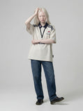 DAXUEN Short-sleeve polo shirt with cartoon dog embroidery — model photo