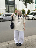 DAXUEN Short-sleeve polo shirt with cartoon dog embroidery — model photo