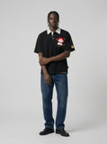 DAXUEN Relaxed-fit short-sleeved polo shirt with cartoon embroidery — model photo