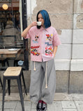 DAXUEN Short-sleeved button-up shirt with cartoon embroidery — model photo